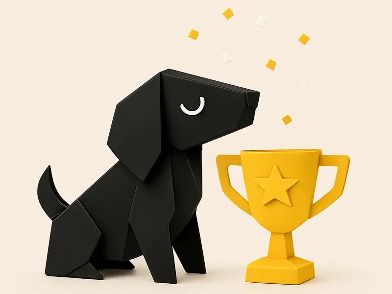 Foldo sitting proudly beside a yellow paper trophy under falling confetti